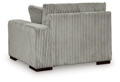 Ashley Furniture Lindyn sectional with chaise, showing plush fabric, modern design, and comfortable seating in a stylish living room.