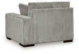 Ashley Furniture Lindyn sectional with chaise, showing plush fabric, modern design, and comfortable seating in a stylish living room.