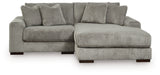 Ashley Furniture Lindyn sectional with chaise, featuring plush fabric upholstery and modern design in a spacious living room setting.