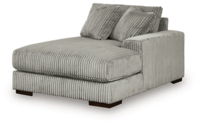 Ashley Furniture Lindyn sectional with chaise, angled view showing soft fabric upholstery and spacious seating arrangement.