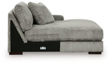 Ashley Furniture Lindyn sectional with chaise, showing a modern fabric sofa with plush cushions and a spacious chaise lounge.