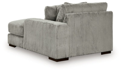 Ashley Furniture Lindyn sectional with chaise, showing plush fabric upholstery and spacious seating in a modern living room setting.