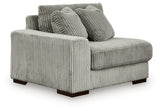 Ashley Furniture Lindyn sectional with chaise, showing a modern fabric sofa with angled design and plush cushions.
