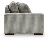 Ashley Furniture Lindyn sectional with chaise, featuring plush cushions and modern design, shown from the side.