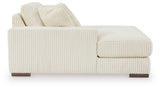 Ashley Furniture Lindyn sectional with chaise, showing light gray fabric, plush cushions, and modern design in a living room setting.