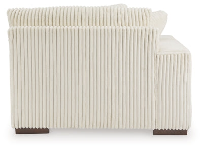 Ashley Furniture Lindyn sectional with chaise, featuring plush upholstery and a modern design, shown from the back.