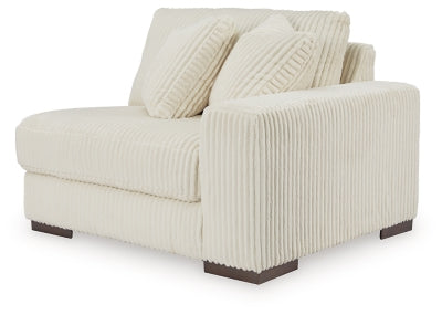 Ashley Furniture Lindyn sectional with chaise, showing a modern fabric sofa with a spacious seating arrangement and angled view.