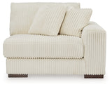 Ashley Furniture Lindyn sectional with chaise, showcasing a comfortable fabric sofa with plush cushions and a modern design.