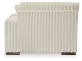 Ashley Furniture Lindyn sectional with chaise, showing plush fabric upholstery and modern design in a living room setting.