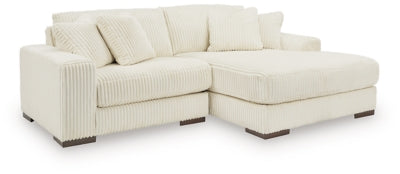 Ashley Furniture Lindyn sectional with chaise, gray fabric, modern design, featuring plush cushions and a spacious seating area.
