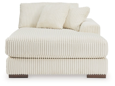 Ashley Furniture Lindyn sectional with chaise, showing a modern fabric sofa with a spacious seating area and chaise lounge.