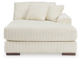 Ashley Furniture Lindyn sectional with chaise, showing a modern fabric sofa with a spacious seating area and chaise lounge.