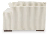 Ashley Furniture Lindyn sectional with chaise, showing a stylish fabric sofa with plush cushions and a spacious chaise lounge.