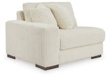 Ashley Furniture Lindyn sectional with chaise, showing a modern fabric sofa with multiple cushions and a spacious seating area.