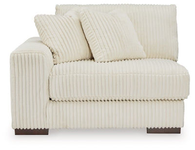 Ashley Furniture Lindyn sectional with chaise, featuring plush fabric and modern design, shown from a head-on perspective.