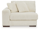 Ashley Furniture Lindyn sectional with chaise, featuring plush fabric and modern design, shown from a head-on perspective.