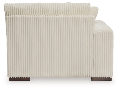 Ashley Furniture Lindyn sectional with chaise, showing plush fabric upholstery and modern design in a living room setting.