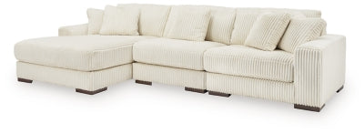 Ashley Furniture Lindyn sectional with chaise, featuring plush fabric upholstery and modern design in a spacious living room setting.
