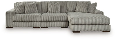 Ashley Furniture Lindyn sectional with chaise, featuring plush fabric, modern design, and multiple seating areas.