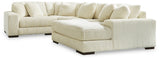 Ashley Furniture Lindyn sectional with chaise, featuring plush fabric and modern design, shown in a cozy living room setting.