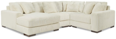 Ashley Furniture Lindyn sectional with chaise, featuring plush fabric upholstery and modern design, in a cozy living room setting.
