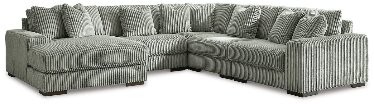 Ashley Furniture Lindyn sectional with chaise showing plush fabric upholstery and modern design in a spacious living room setting