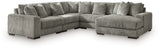 Ashley Furniture Lindyn sectional with chaise, featuring plush fabric and modern design, shown in a spacious living room setting.