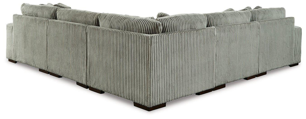 Ashley Furniture Lindyn sectional with chaise, showing a modern fabric sofa with plush cushions and a spacious chaise lounge.
