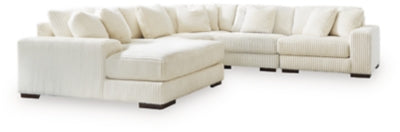 Ashley Furniture Lindyn sectional with chaise, featuring plush upholstery and modern design, shown with comfortable seating arrangement.