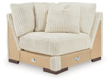 Ashley Furniture Lindyn sectional with chaise, beige fabric, contemporary design, featuring plush cushions and a spacious seating area.