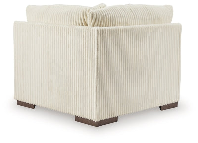 Ashley Furniture Lindyn sectional with chaise, showing the back view of the modern fabric sectional sofa.