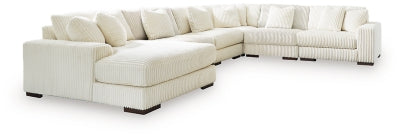 Ashley Furniture Lindyn sectional with chaise, modern fabric sofa showing plush cushions and a spacious design.