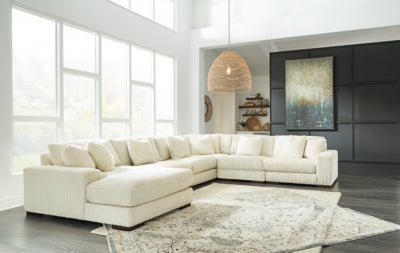 Ashley Furniture Lindyn sectional with chaise, showcasing plush fabric upholstery and modern sectional design.
