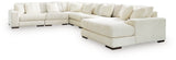 Ashley Furniture Lindyn sectional with chaise, featuring plush fabric and modern design, shown in a spacious living room setting.