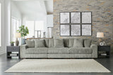 Ashley Furniture Lindyn sectional sofa with plush fabric, featuring multiple seating sections and a modern design in neutral tones.