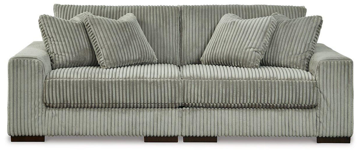 Ashley Furniture Lindyn sectional sofa with plush cushions and modern design, shown in a spacious living room setting.