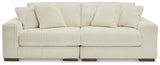 Ashley Furniture Lindyn sectional sofa with plush cushions and neutral fabric, showcasing a modern L-shaped design in a living room setting.