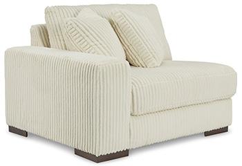 Ashley Furniture Lindyn sectional sofa with plush cushions and modern design, shown in a cozy living room setting.
