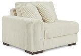 Ashley Furniture Lindyn sectional sofa with plush cushions and modern design, shown in a cozy living room setting.
