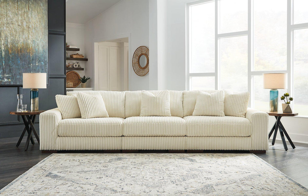 Ashley Furniture Lindyn sectional sofa with plush fabric and modern design, shown in a stylish living room setting.