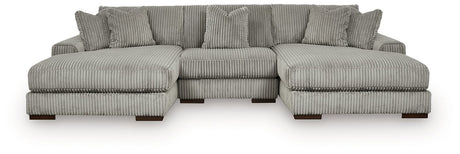Ashley Furniture Lindyn sectional with double chaise, showcasing plush fabric, modern design, and ample seating in a stylish living room.