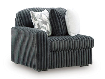 Ashley Furniture Midnight-Madness sectional sofa shown from an angled view, featuring plush cushions and modern design.