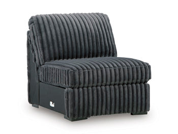 Ashley Furniture Midnight-Madness sectional sofa shown from an angled view, featuring plush cushions and dark fabric upholstery.