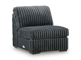 Ashley Furniture Midnight-Madness sectional sofa shown from an angled view, featuring plush cushions and dark fabric upholstery.