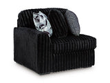 Ashley Furniture Midnight-Madness sectional sofa shown from an angled view, featuring plush cushions and modern design.