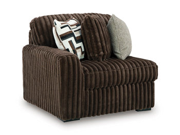 Ashley Furniture Midnight-Madness sectional sofa shown from an angled view, featuring plush cushions and modern design.
