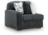 Ashley Furniture Midnight-Madness sectional sofa in dark fabric, shown from an angled view highlighting its modern design.