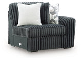 Ashley Furniture Midnight-Madness sectional sofa with dark upholstery and modern design, shown from an angled side view.