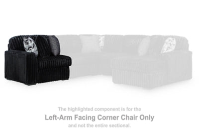 Midnight-Madness sectional sofa by Ashley Furniture, dark fabric with plush cushions and modern design in a living room setting