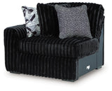 Ashley Furniture Midnight-Madness sectional sofa viewed from an angle, showcasing its spacious design and dark upholstery.
